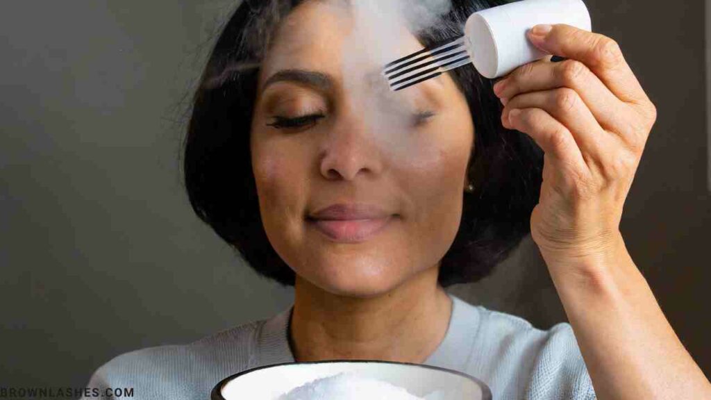 Image of someone using steam for lash glue removal, perhaps a facial steamer or a person holding their face over a bowl of hot water.