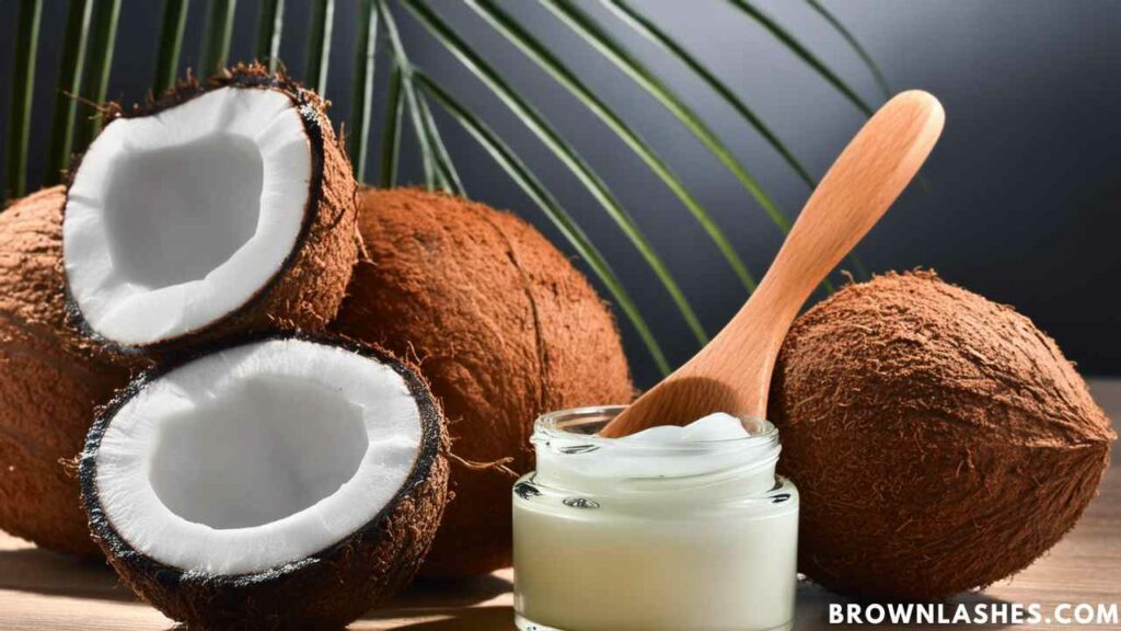 Person applying coconut oil to eyelashes, a natural remedy for moisturizing and strengthening lashes.