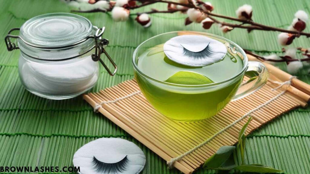 Woman gently removing eye makeup with a cotton pad to maintain eyelash health and prevent lash breakage.